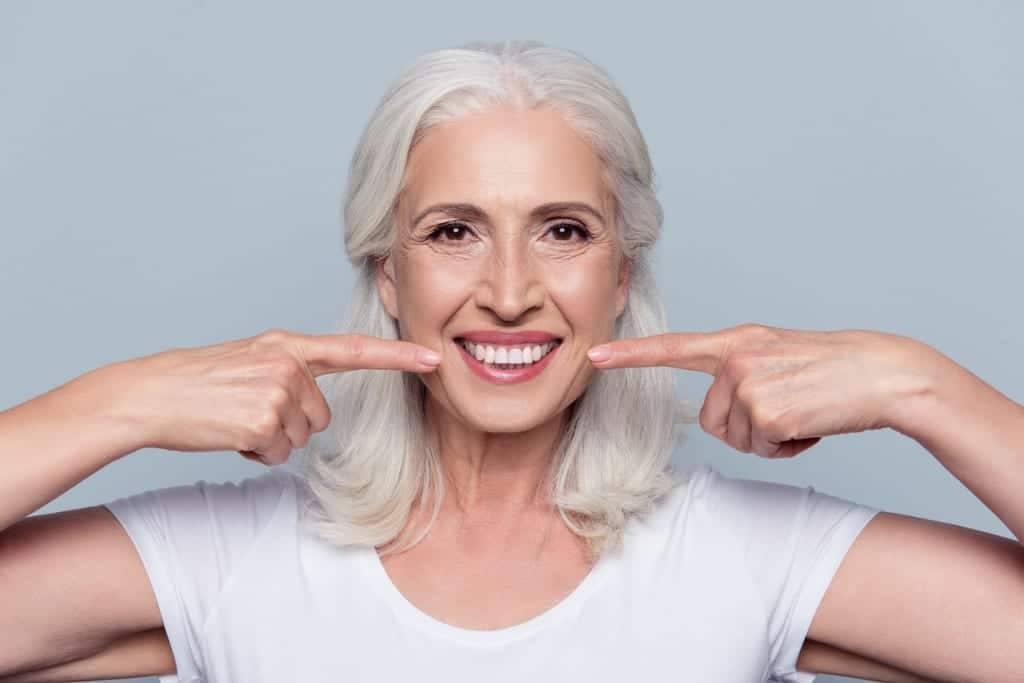 concept of having strong healthy straight white teeth at old age up picture id925898340