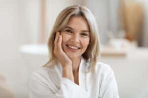 Woman smiling after one-day dental implants in Milwaukee, WI