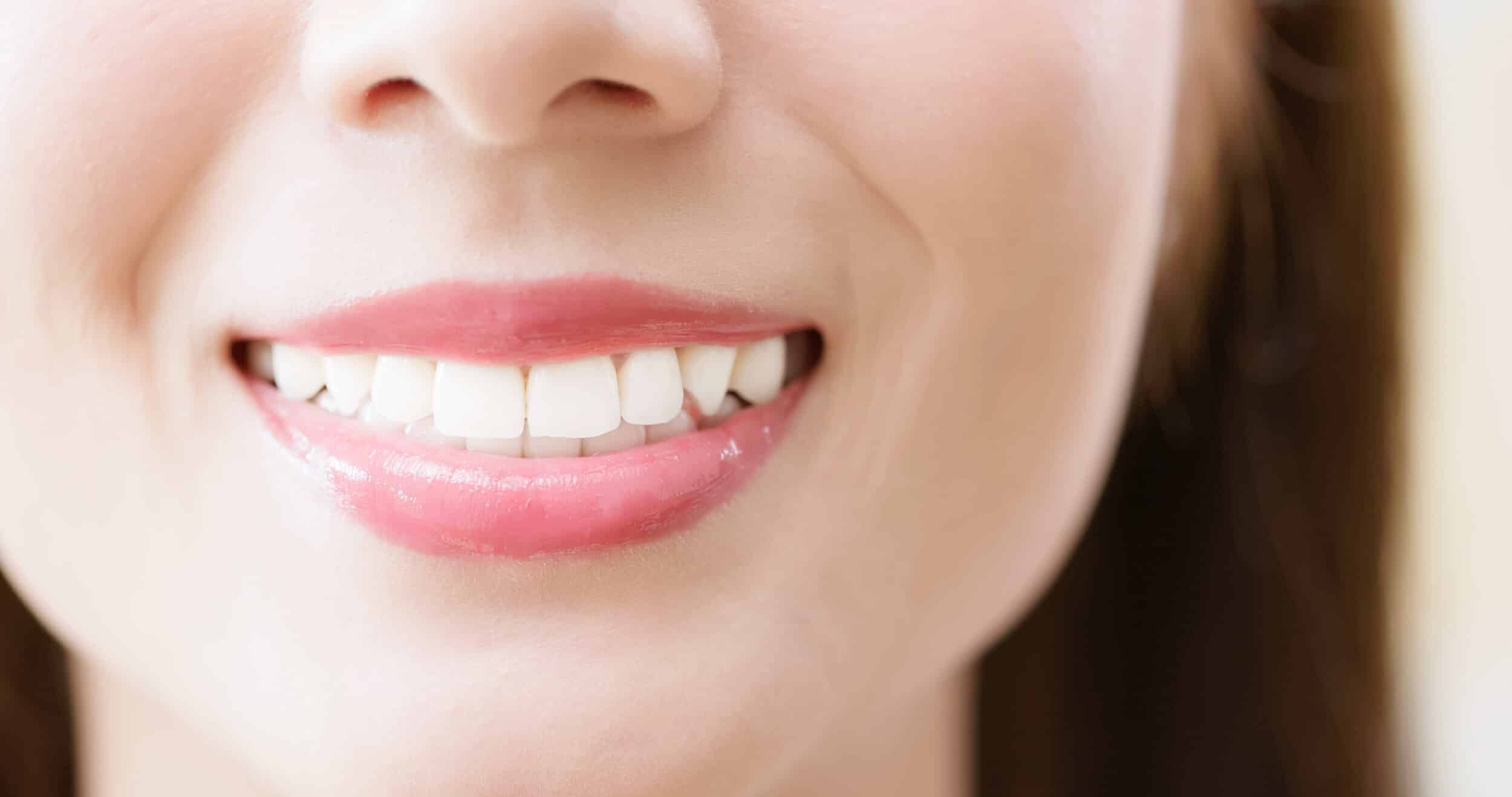 closeup of smiling pretty female with beautiful white teeth very charming